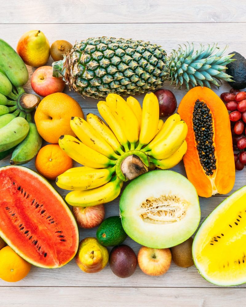 Mixed fruits with apple banana orange and other Mixed fruits with apple banana orange and other on wooden background - Healthy food style